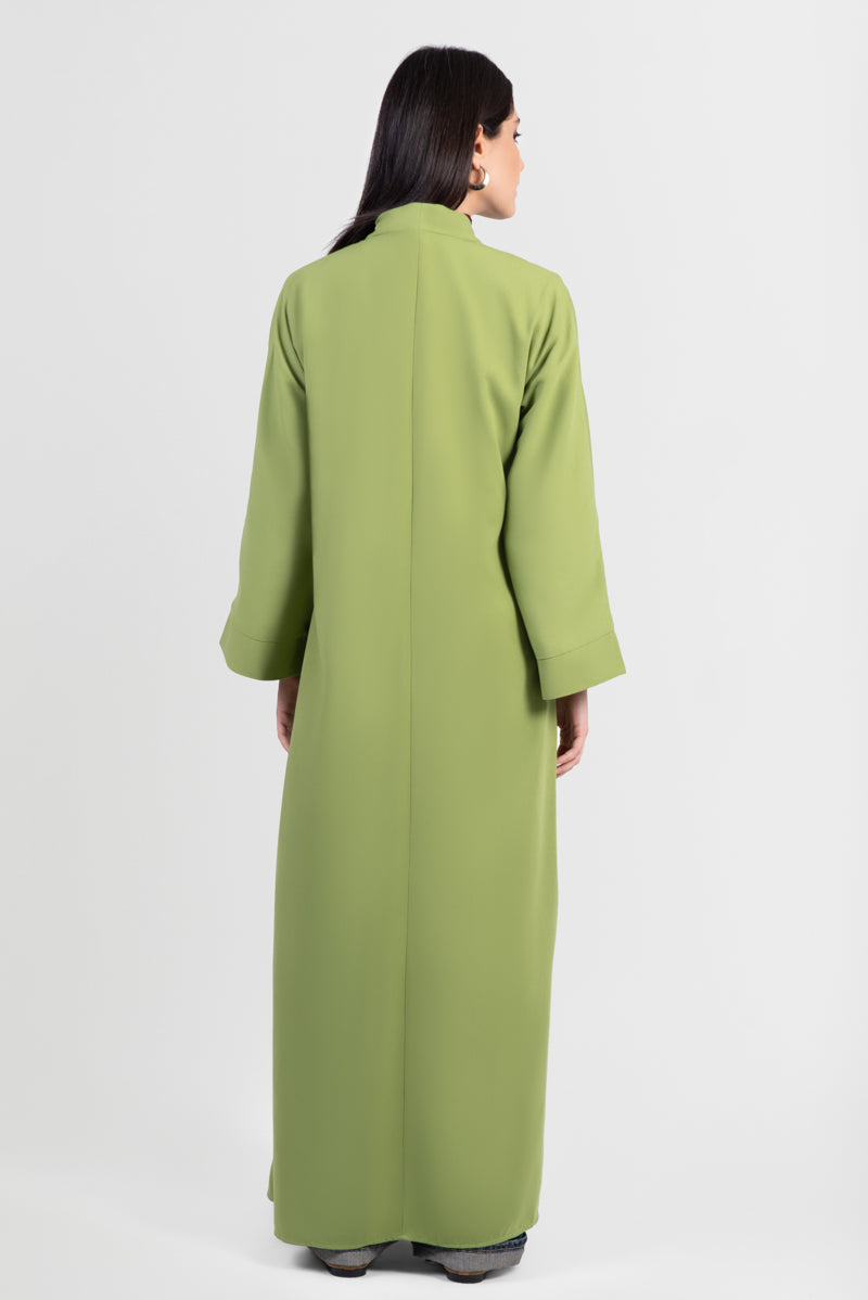 Moss green abaya with black embroidery and bright green outline, back view