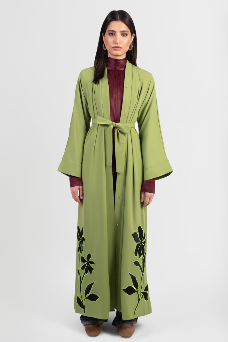 Moss green abaya with black embroidery and bright green outline, with matching belt.
