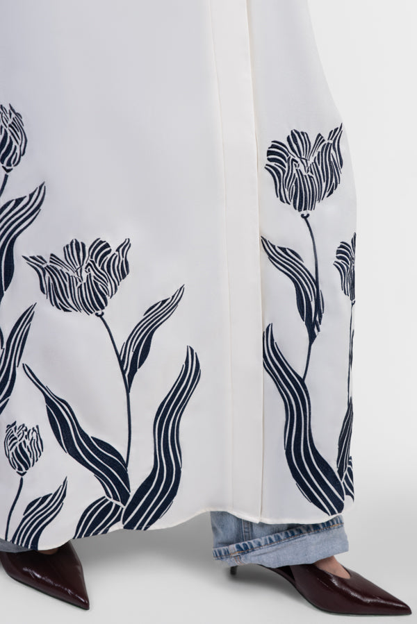 Off-white abaya with navy embroidered floral details