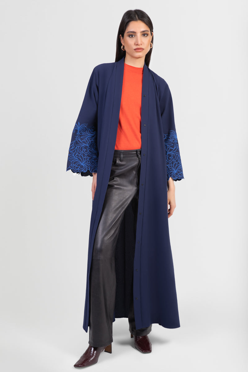 Navy cotton abaya with light blue embroidered floral design around sleeves open front