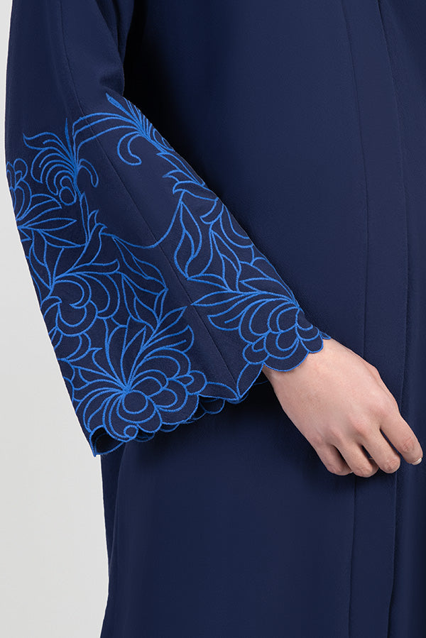 Navy cotton abaya with light blue embroidered floral design around sleeves details