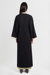 Black linen cotton kimono-style abaya with off-white trim along edges and matching belt back view