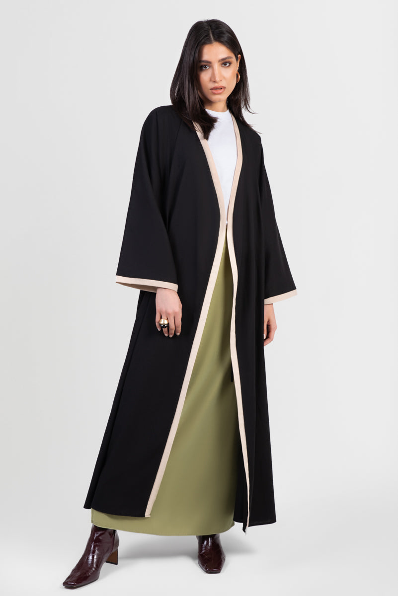 Black linen cotton kimono-style abaya with off-white trim along edges and matching belt front view open front