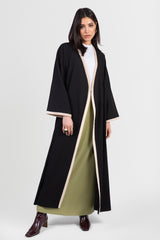 Black linen cotton kimono-style abaya with off-white trim along edges and matching belt front view open front