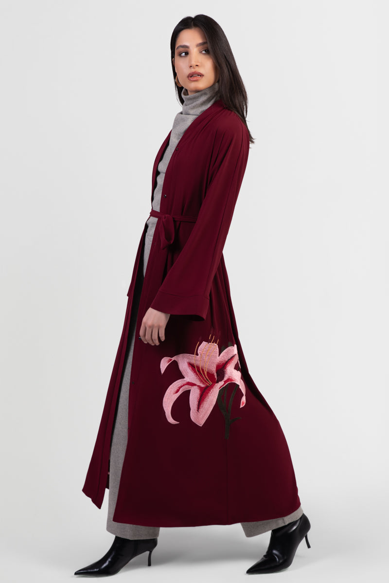 Burgundy abaya with pink lily embroidery around bottom hemline open front 
