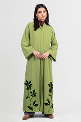 Moss green abaya with black embroidery and bright green outline front view