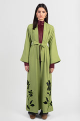 Moss green abaya with black embroidery and bright green outline, with matching belt.
