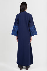 Navy cotton abaya with light blue embroidered floral design around sleeves back view